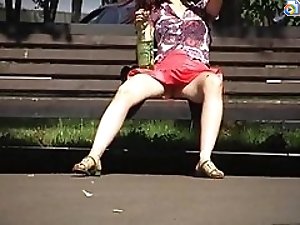 2 movies - Hidden upskirt video of amateur girl flashing her pussy when resting on the bench