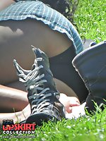 12 pictures - Curly brunette voyeured in a public place. Upskirt images
