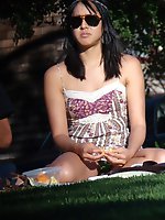 12 pictures - Hot brunette on a glade. Young girl upskirt