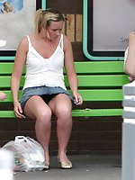 12 pictures - Upskirt sitting - blonde in mini at the bus stop