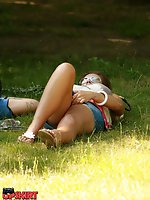 12 pictures - Simply upskirt - she's lying on grass and is being voyeured