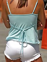 Upskirt pictures - Cute blonde gets spied wearing fishnets and shorts