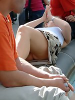 Upskirt pictures - Blonde babe has nice tattoo and, of course, sexy upskirt