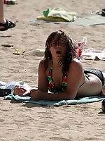 Upskirt pictures - A shaved girl at the Matira