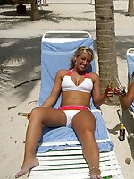 Upskirt pictures - A bikini cutie going topless on the Waikiki
