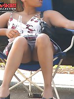 12 pictures - This chocolate babe is very hot. Up the skirt