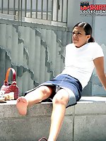 Upskirt pictures - Young brunette caught sitting. Candid upskirt