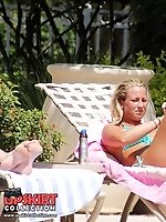 12 pictures - Bikini girls erotically lie on beach