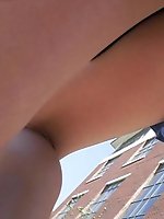 Upskirt pictures - Pretty brunette in blue skirt. Candid street upskirt
